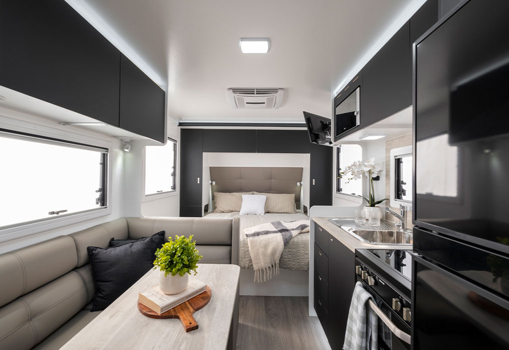 Queen-size bed & kitchen with dinette