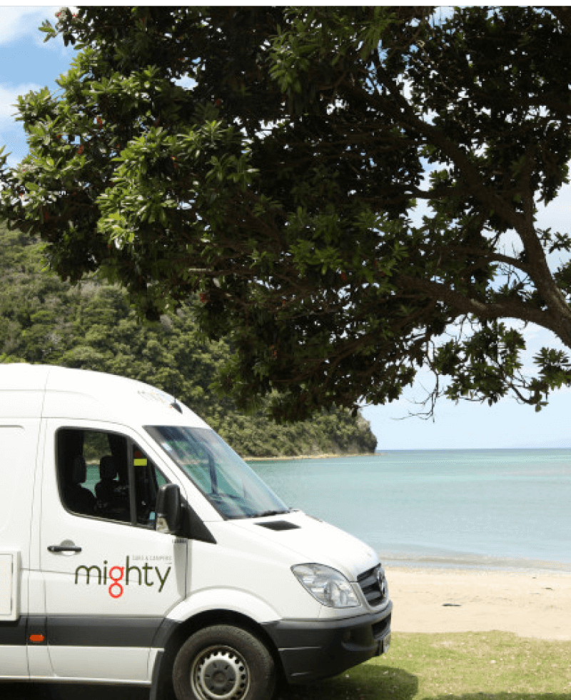 Camper in front of water