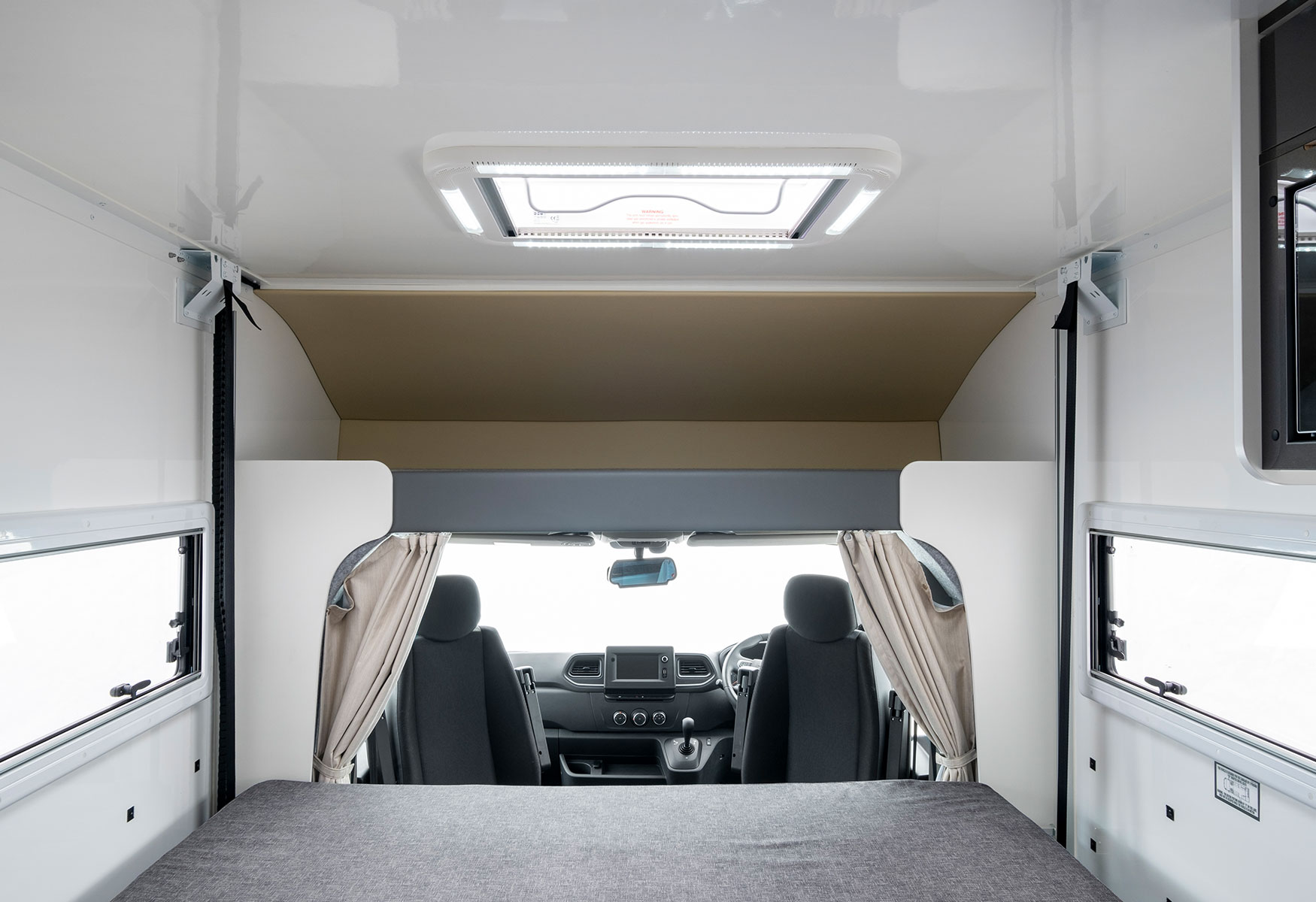 Dinette/lounge converts to drop-down bed