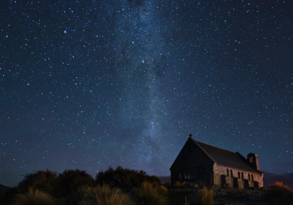 Evening view of a house with the milky way