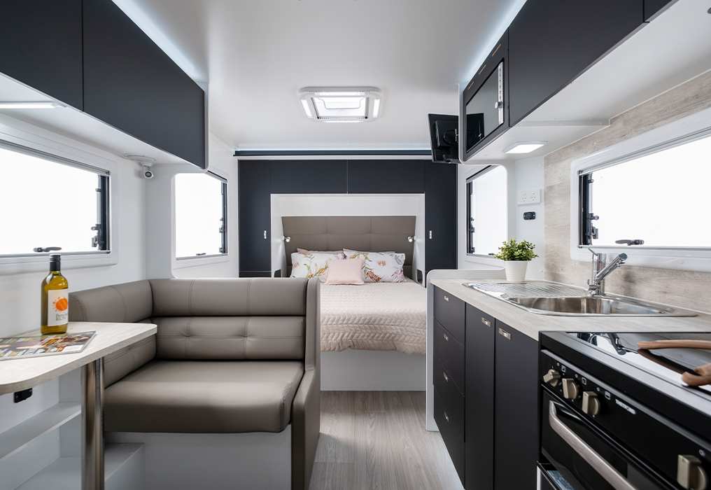 Queen-size bed and kitchen with seating