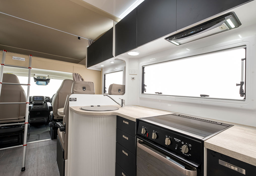 Kitchen with ample storage and modern appliances, showcasing organized cabinetry and state-of-the-art cooking equipment.