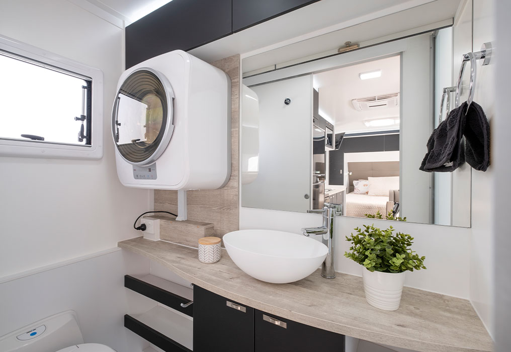 Interior featuring air conditioning, a full-size ensuite, and a flushing toilet, showcasing comfort and modern amenities