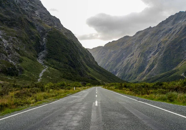 Road leading to some very steep mountain ranges