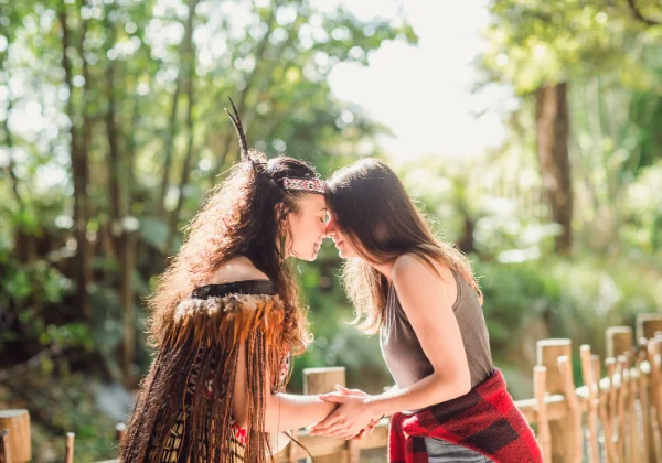 Maori greeting, two people touching noses