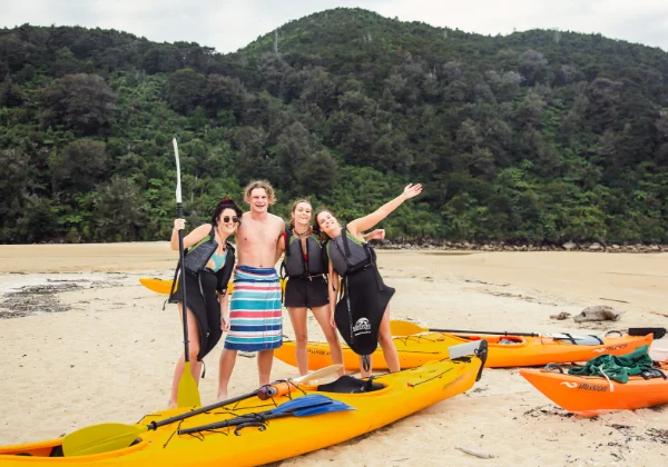 4 people posing before they go Kayaking