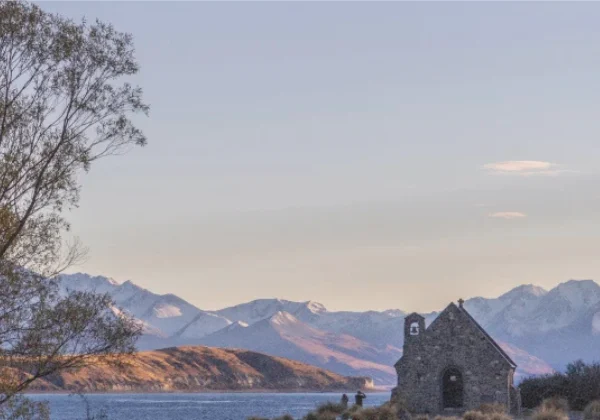 Church, lake and mountains
