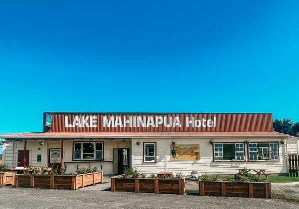 Lake Mahinapua Hotel on a sunny day