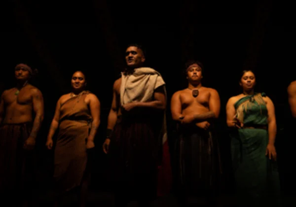 5 people in traditional Maori dress