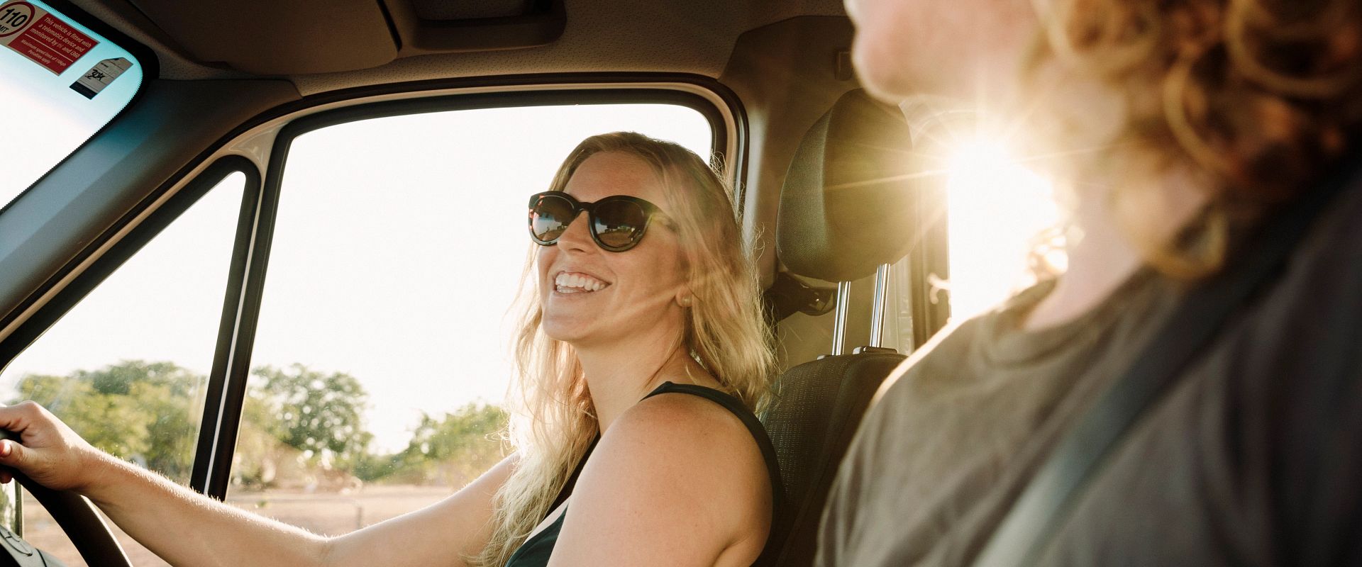 Couple driving in a campervan