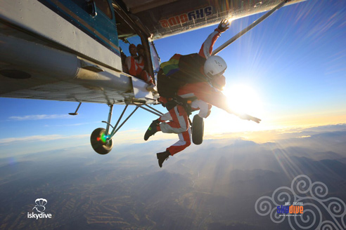 Skydiving tandem just jumping out of the plane