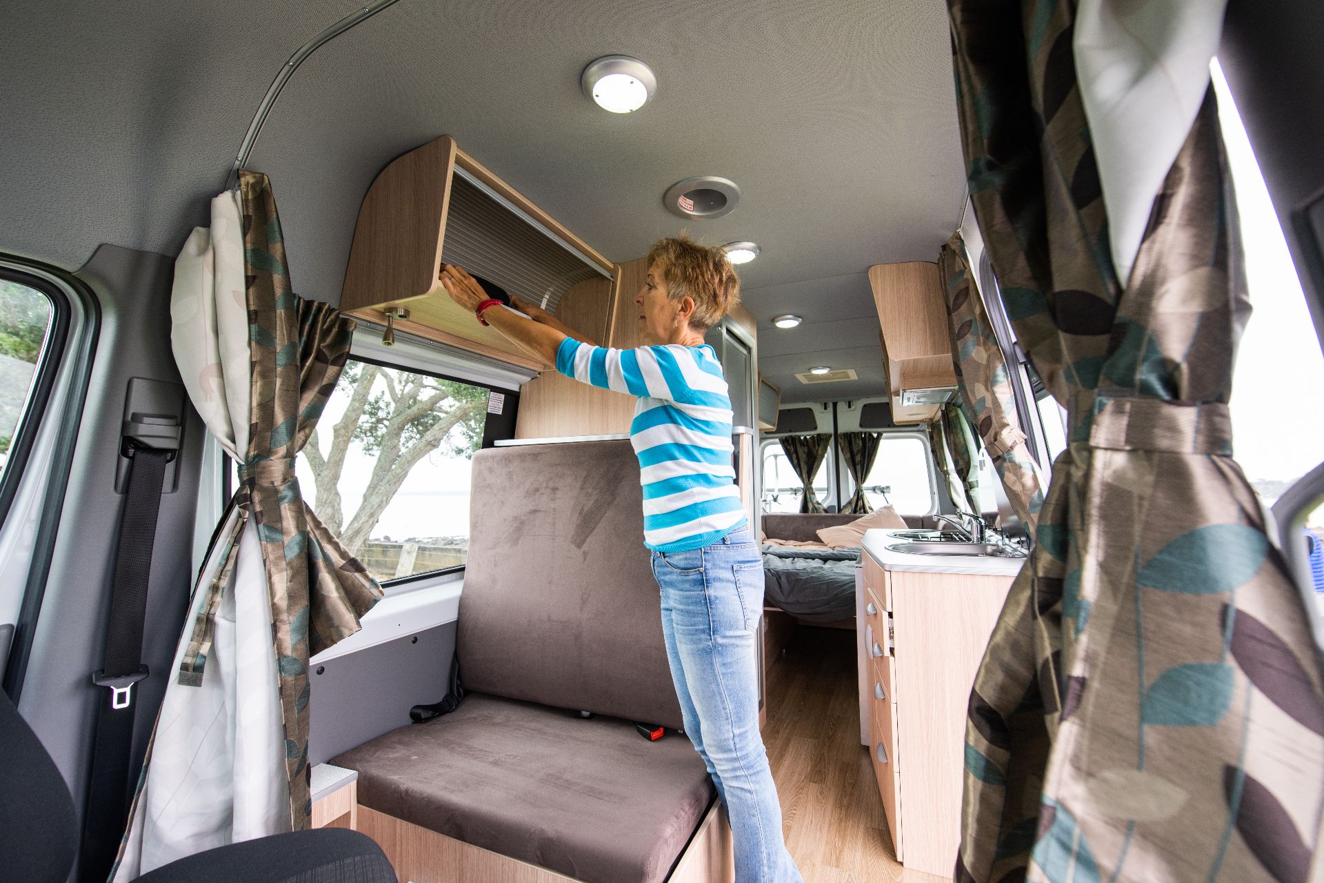 Woman packing campervan